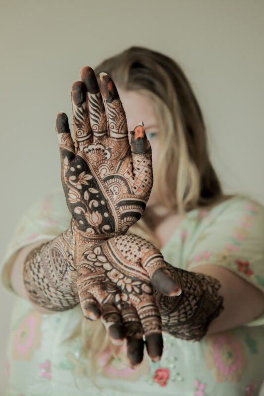 Bridal mehndi portrait photography with detailed mehndi design and candid expressions – Noida