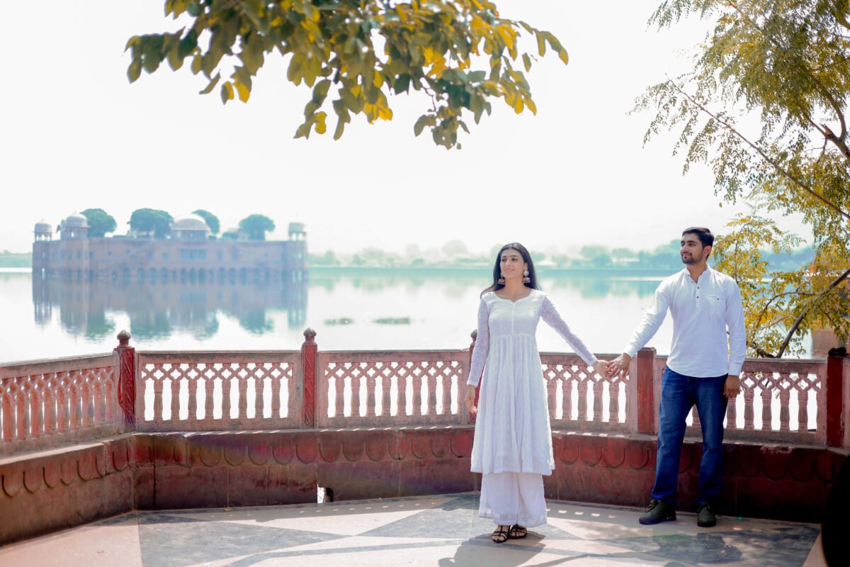 Couple standing together at a scenic Jaipur lake