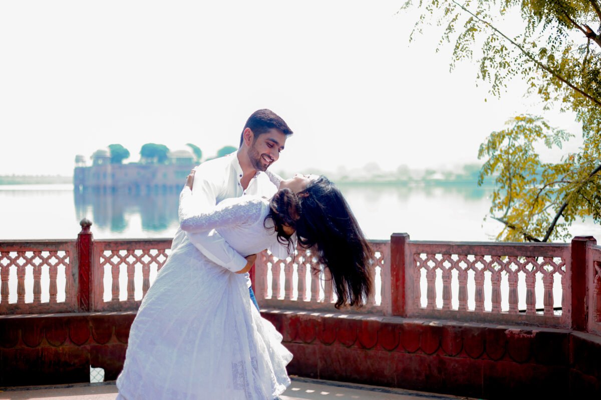 Couple enjoying a romantic moment beside Jaipur lake