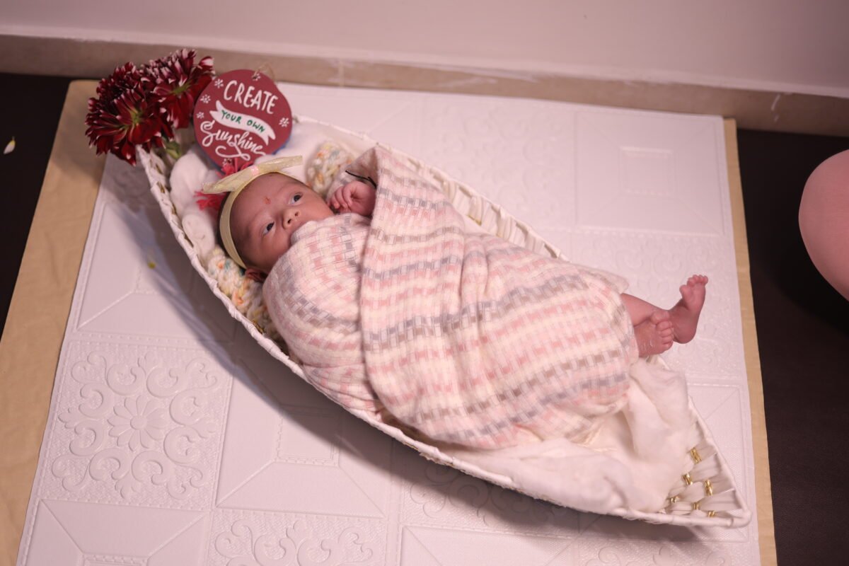 Newborn baby sleeping in basket