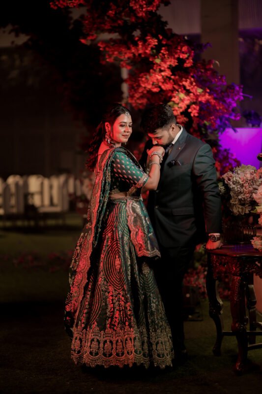 Romantic Indian engagement couple portrait under evening lights