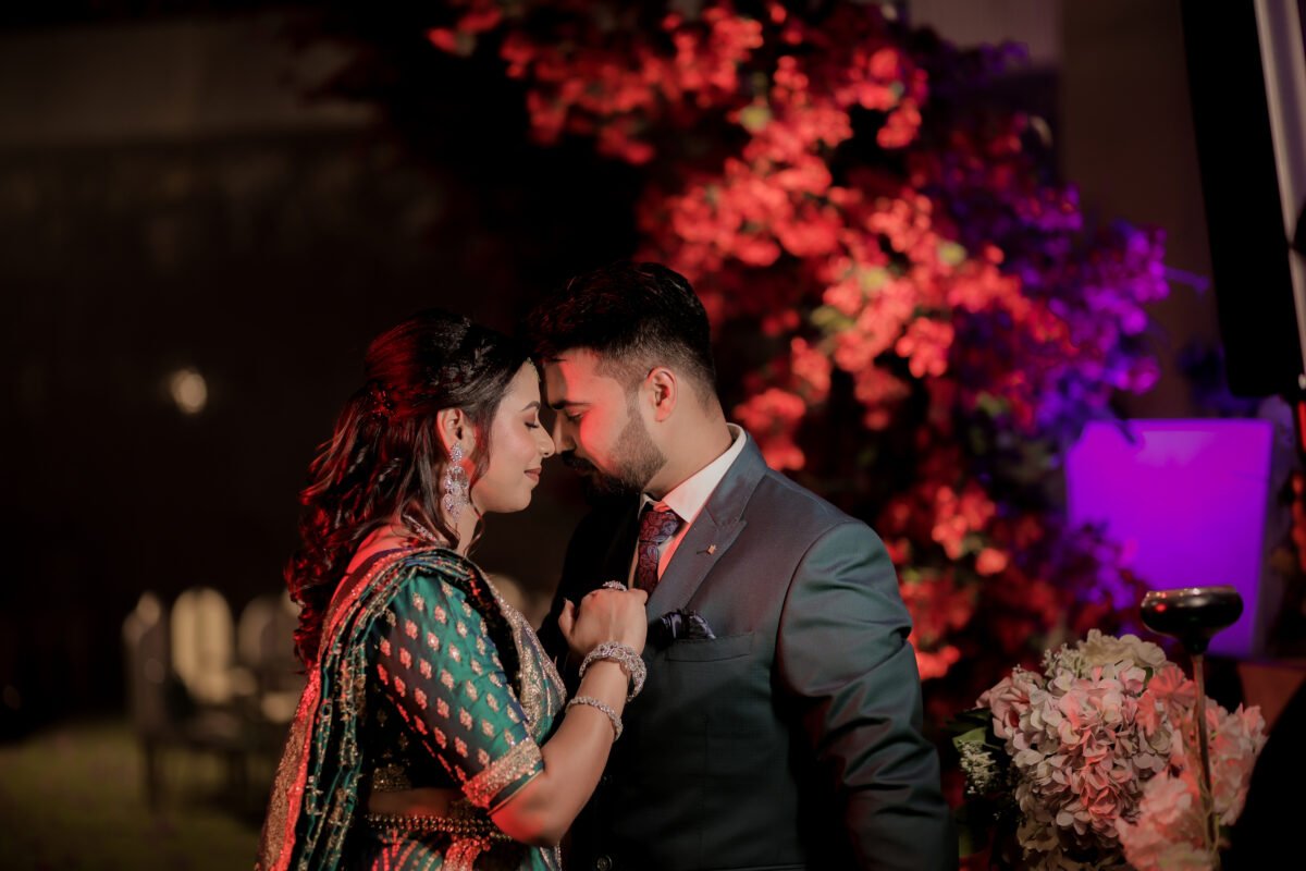 Romantic Indian engagement couple sharing a kiss