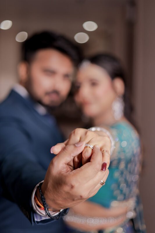 Engagement couple ring close-up with romantic portrait