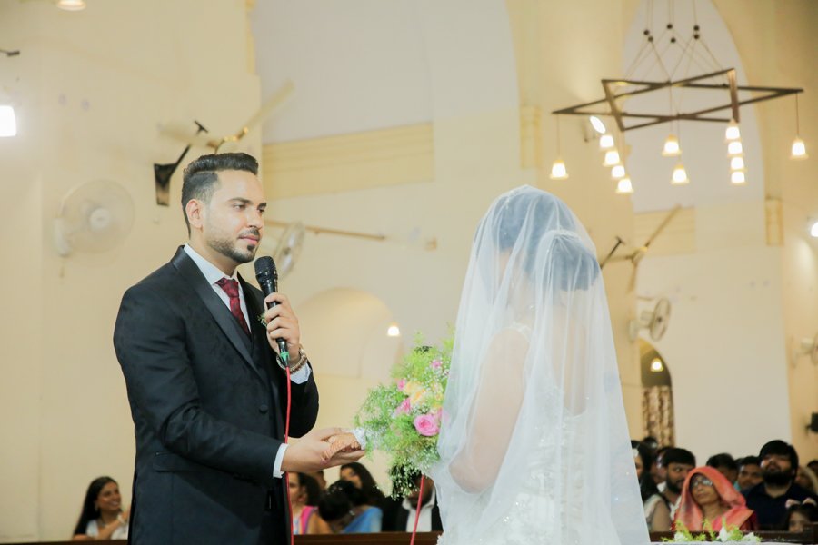 Bride and groom exchanging vows emotional wedding moment Delhi NCR