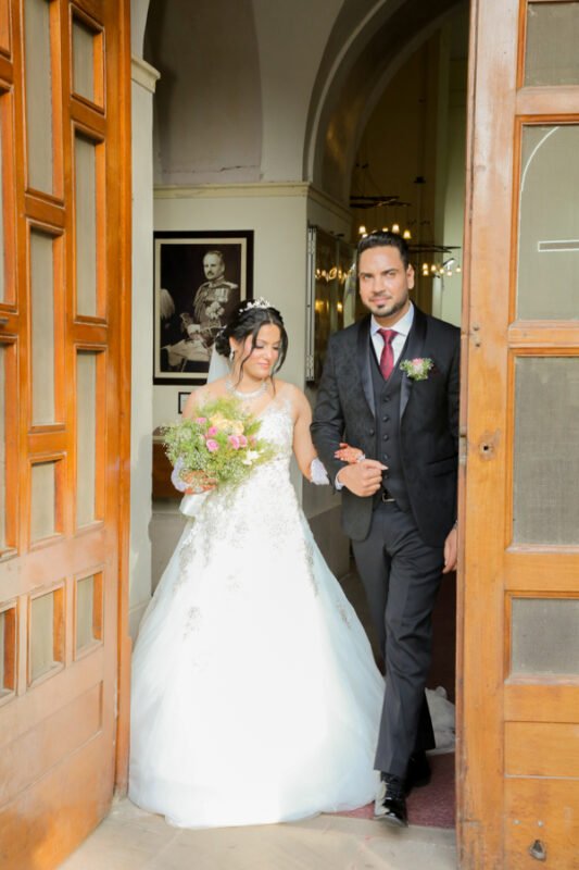 Wedding couple entry moment indoor venue Delhi NCR professional photography