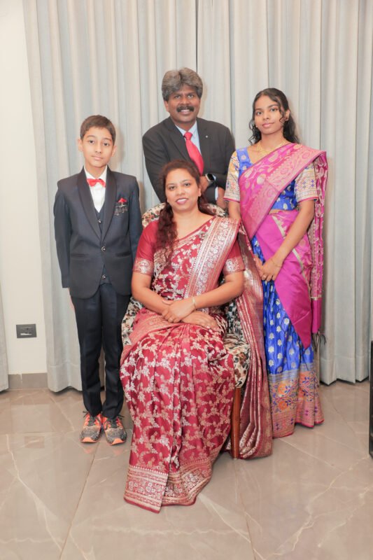 Happy family photoshoot portrait indoor traditional outfit candid family photography