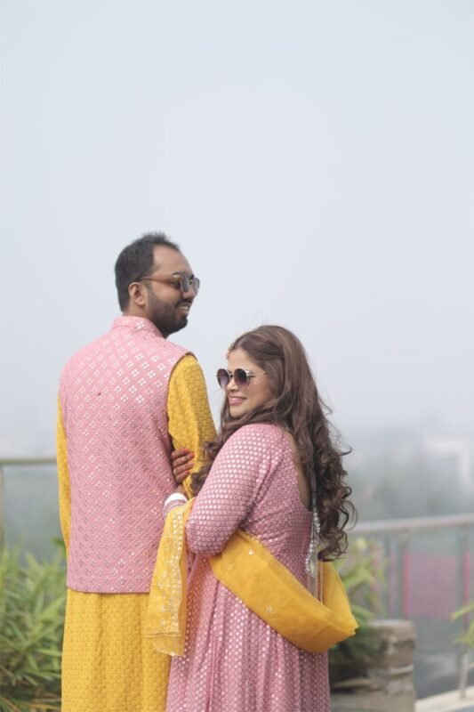 Stylish haldi ceremony portrait with bride and groom candid moments