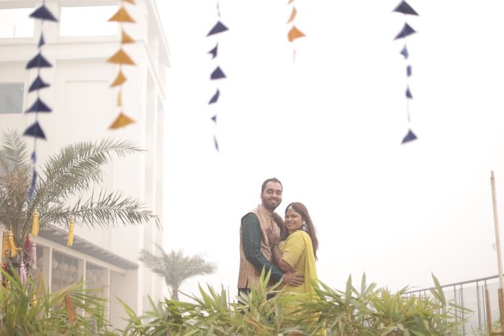 Candid mehndi ceremony photography with romantic couple poses outdoors