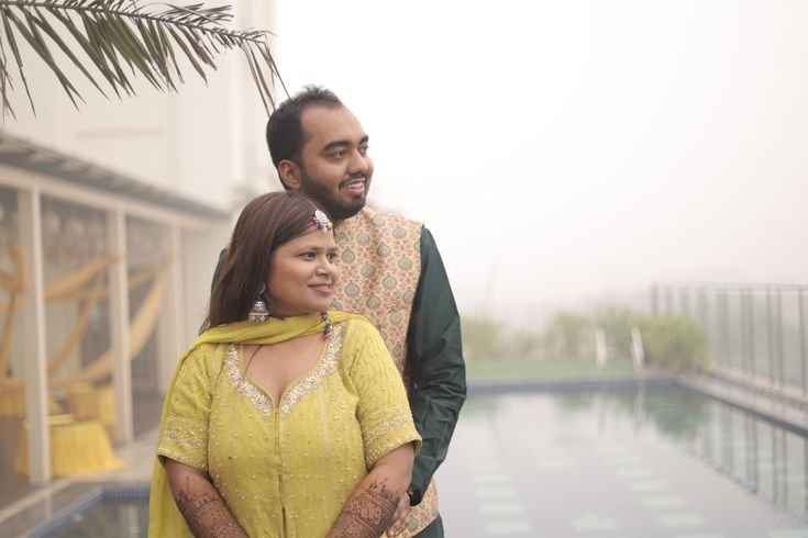 Beautiful mehndi couple portrait during colorful wedding celebration