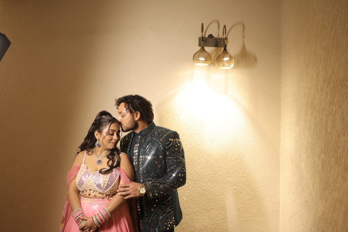 Romantic engagement couple portrait under warm lights