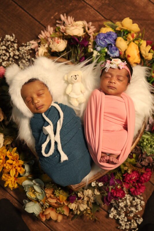 Twin newborn baby photography with creative posing