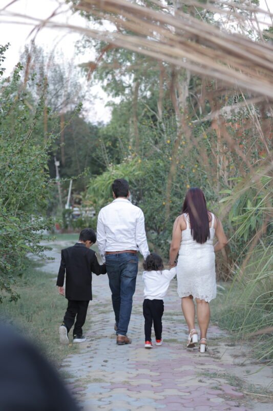 Family walking together during an outdoor family photoshoot