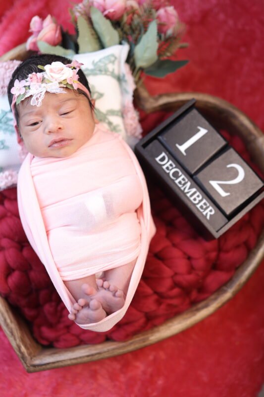 Professional newborn baby photoshoot with milestone card in Delhi NCR by Make Your Moment Photography