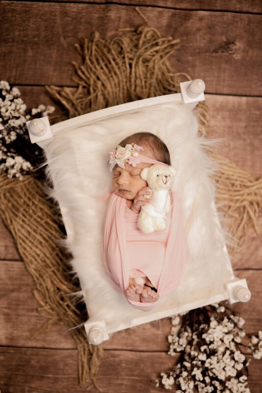 Newborn baby girl sleeping photoshoot by Make Your Moment Photography