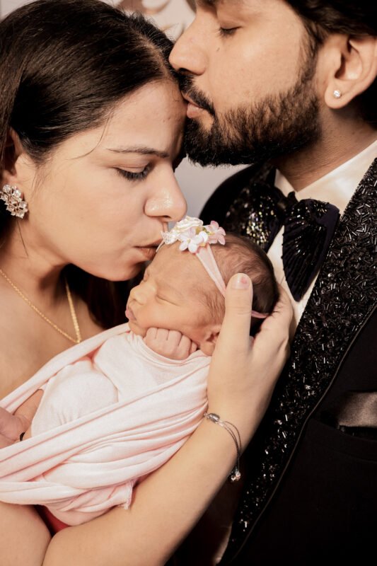 Newborn baby girl photoshoot with loving parents