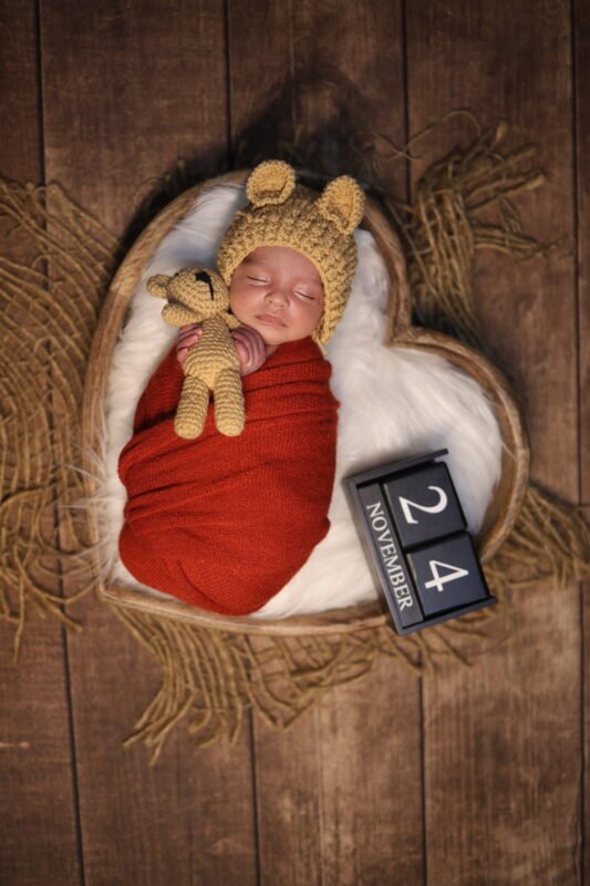 Sleeping Newborn Baby with Teddy Bear
