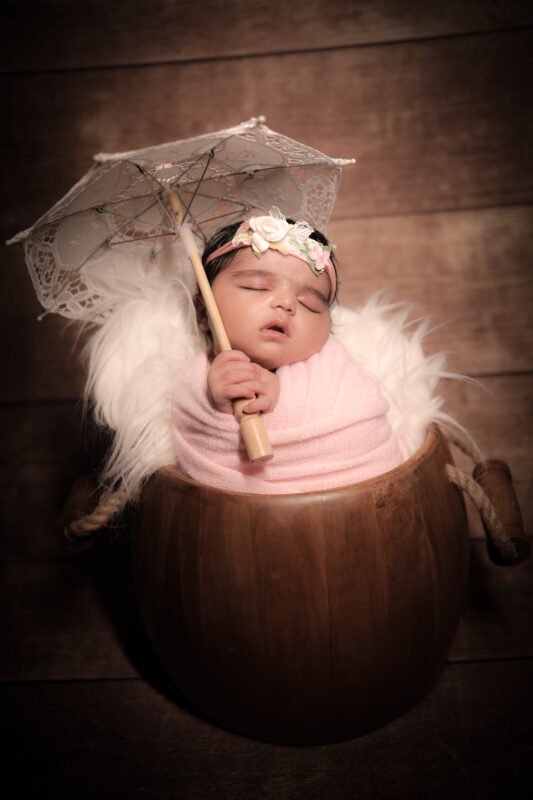Sleeping newborn baby girl photography in Noida