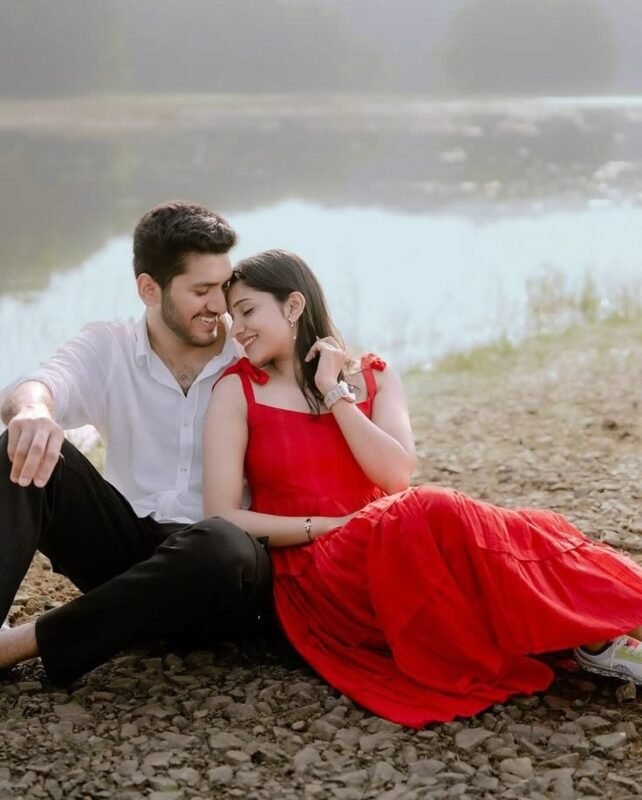 Romantic couple sitting by the lake during a pre wedding photoshoot in Delhi NCR