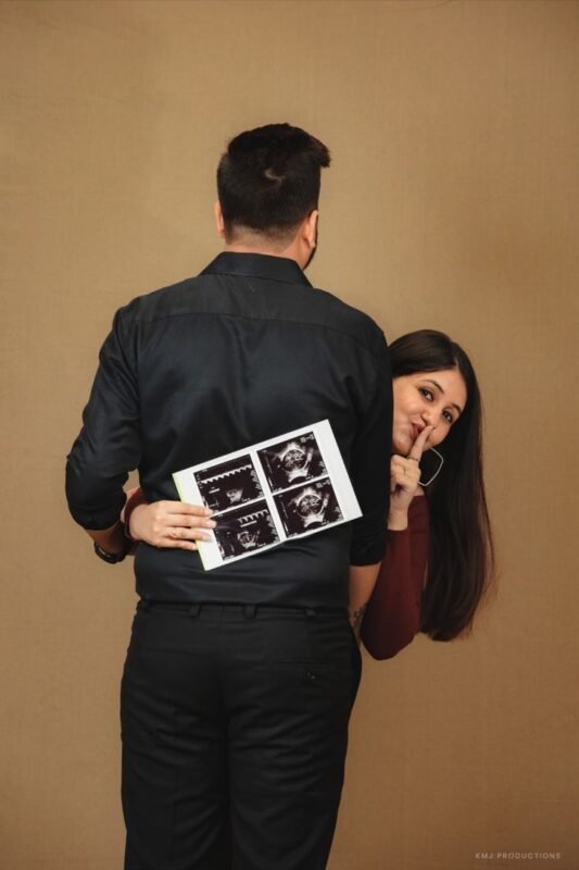 Creative maternity photoshoot with baby bump and expecting parents in Delhi NCR