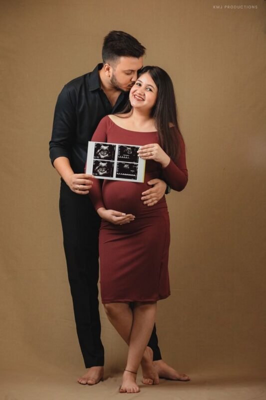 Pregnancy announcement photoshoot with ultrasound photo in Delhi NCR