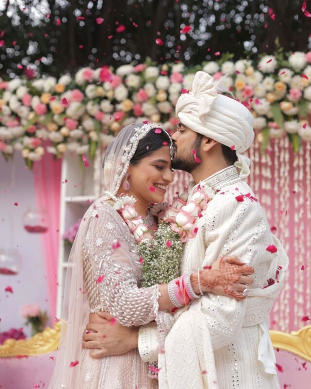 Bride and groom sharing a romantic embrace.