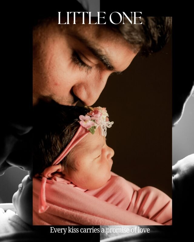 Father Kissing Newborn Baby